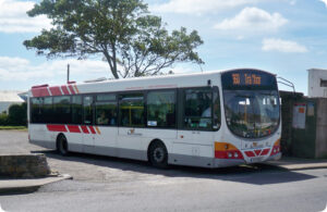Public bus displaying route 360 to Tramore stopped at a roadside bus stop.